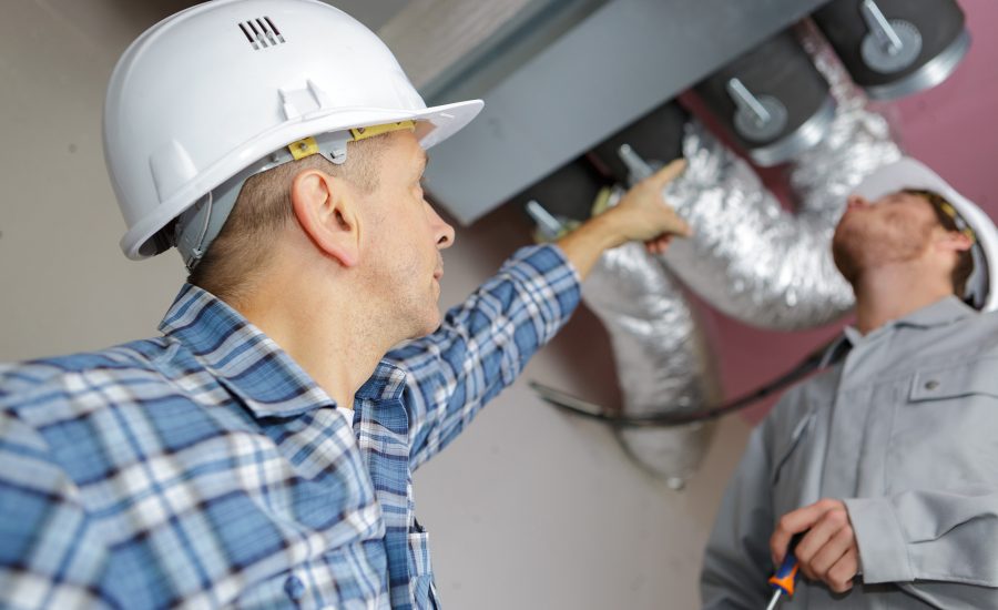 manager giving orders to coworkers fixing air conditioning manager giving orders to coworkers fixing air conditioning